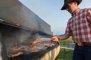 Barbecuing on a large grill