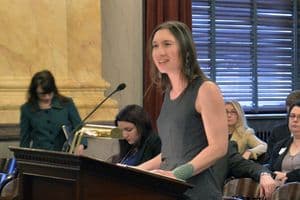 Speaking in front of flags